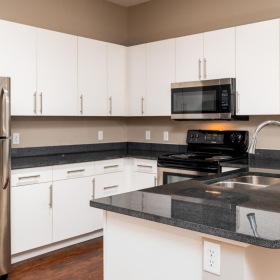 a kitchen with white cabinets