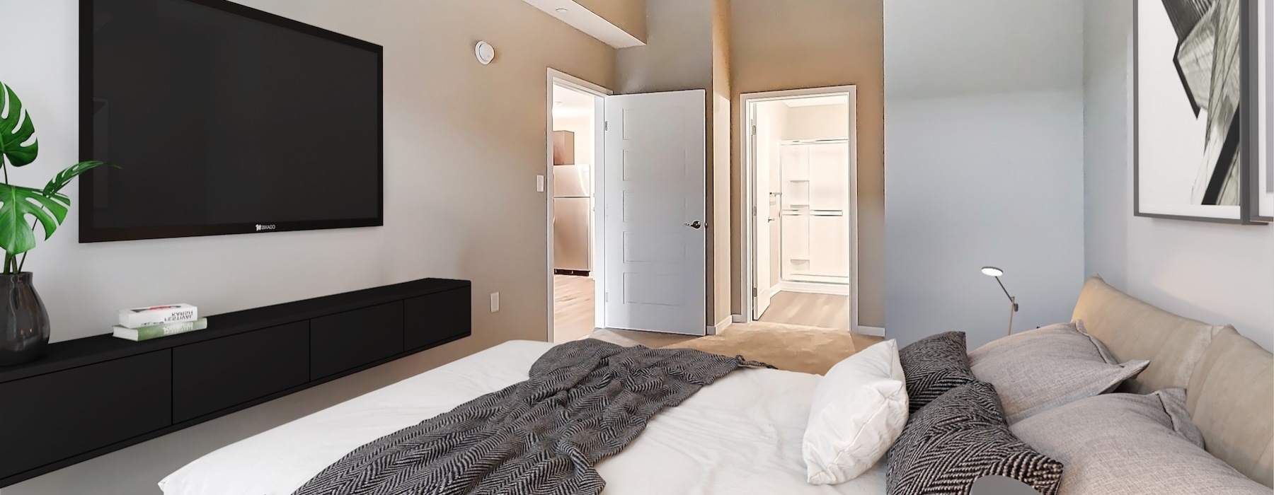 a bedroom with a bed and a tv