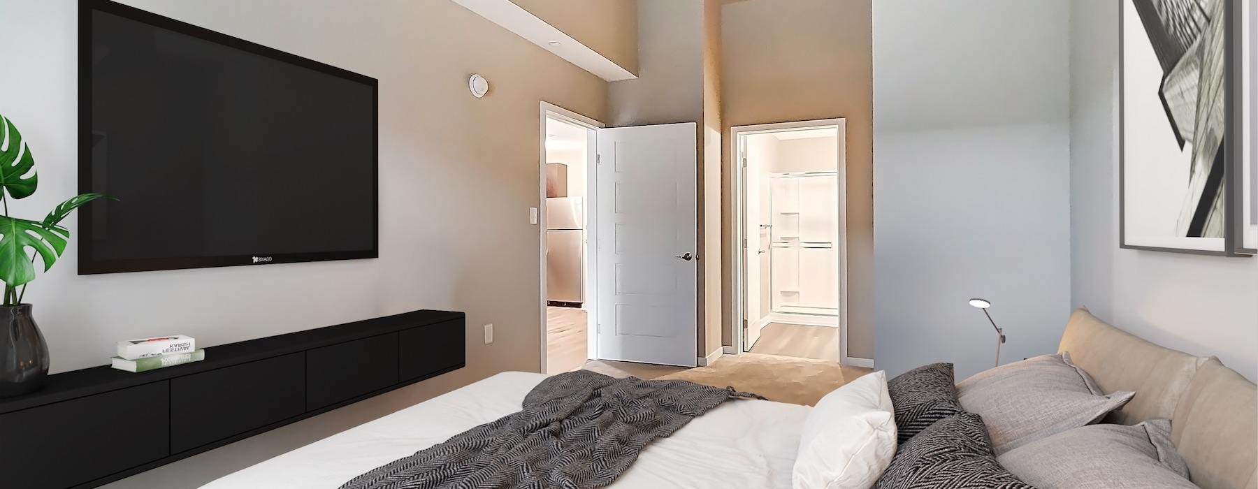 a bedroom with a bed and a tv