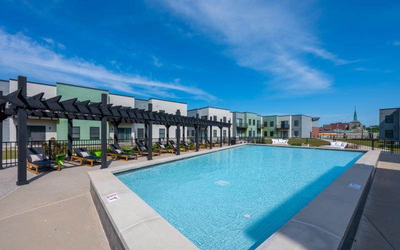 a swimming pool in front of a building