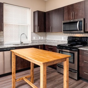 a kitchen with wooden cabinets